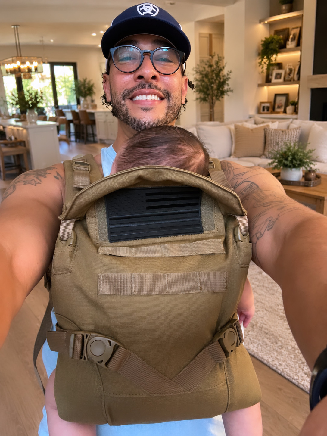 Dione carrying his baby