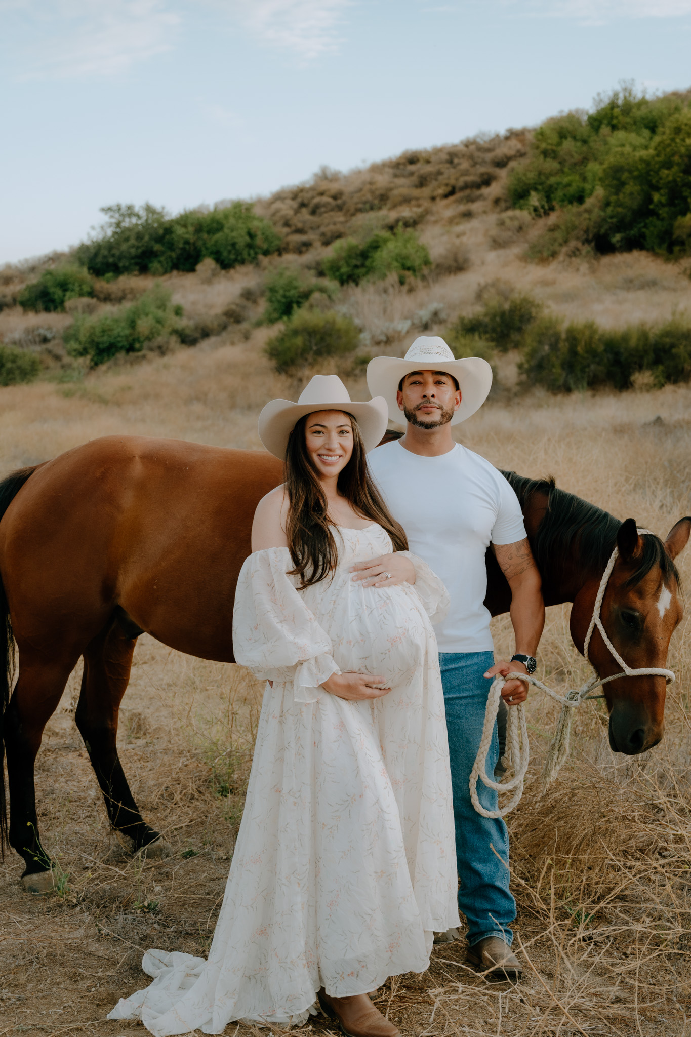 Dione and his wife during their maternity session with their horse